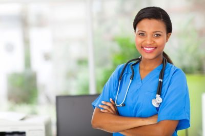 Smiling nurse in scrubs with a stethoscope