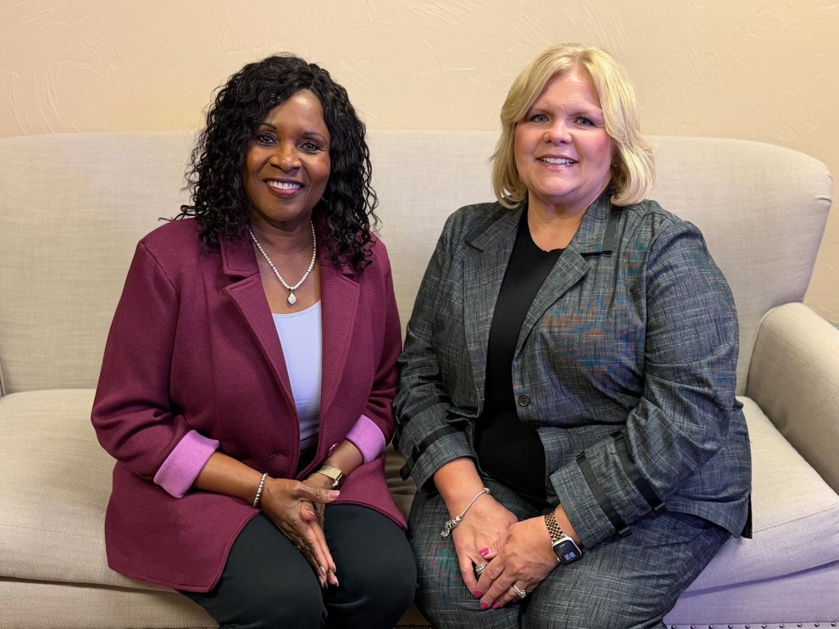 Lydia Sowah, RN, Administrator, and Dana Brown, RN, Director of Clinical Services, seated together on a sofa